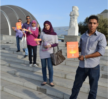 Photo of four researchers and students in Egypt advocating for open access.