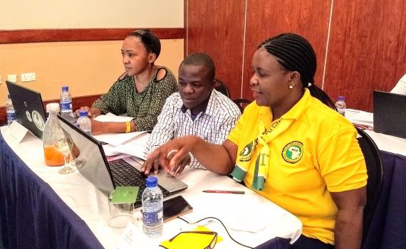 Three Zambian librarians at training, learning about ICT.